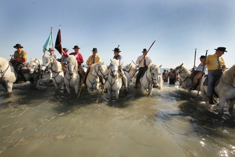  SAINTES MARIES DE LA MER, FRANCE -MAY 25. The Camargue Gardians open the march to the sea.Roms,Manouches,Tziganes and other gypsies  come from all over Europe and even from other continents to worship their Saint , Sara the black.The statue of Sara ,carried by the Gypsies to the sea, symbolizes the waiting forand welcome of the Saints Mary Jacobe and Mary SalomeThis march to the sea is in memory of the arrival of their saint.on July 10, 2010 in Saintes Maries de la mer, France. (Photo by Patrick Aventurier/Getty Images) 