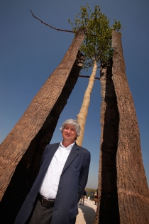  VERSAILLES, FRANCE - JUNE 06:  Italian artist Giuseppe Penone poses in front his sculture ‟Tra scorza e scorza‟ at Chateau de Versailles on June 6, 2013 in Versailles, France. The exhibition in the garden of Versailles organized as part of the 400 year of birth of famous french gardener Andr