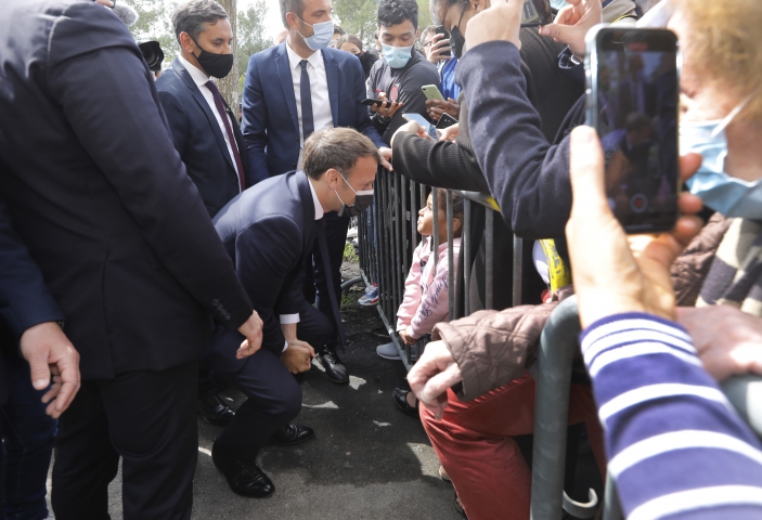  French President Emmanuel Macron meet people in La Mosson neighborhood during his visit in Montpellier, France on April 19, 2021.Macron and his Minister of Interior, Gerald Darmanin, make a one day visit to Montpellier on the theme of security and policing.Photo by Patrick Aventurier/Abacapress