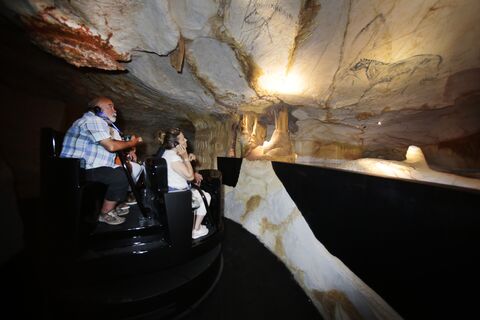  MARSEILLE, FRANCE - MAY 20:Henri Cosquer visit the cave with friend during the first visit for 1000 people in Cosquer cave in Marseille before the official opening the 4 june on May 20, 2022 in Marseille, France. As the replica cave opens its doors to visitors, a team of archaeologists and divers are racing to save the ancient underwater cave paintings from climate change and marine pollution in south-east France. (Photo by Patrick Aventurier/Getty Images)