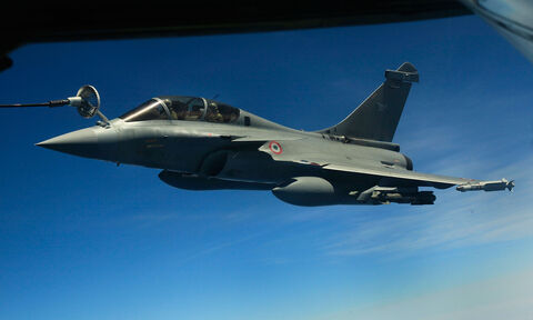  ISTRES, FRANCE - APRIL 09:  French air force Rafale figther jet refuels with an Boing C.135 refuelling tanker aircraft over Mediterranean sea during the air operation "Harmattan", the non-fly zone operations in the critical region on Benghazi in accordance with the United Nations.on April 9, 2011 in Istres, France.  (Photo by Patrick Aventurier/Getty Images)