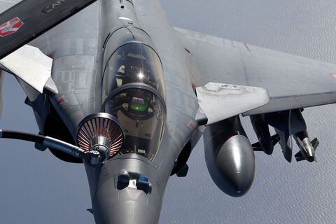  ISTRES, FRANCE - APRIL 09:  French air force Rafale figther jet refuels with an Boing C.135 refuelling tanker aircraft over Mediterranean sea during the air operation "Harmattan", the non-fly zone operations in the critical region on Benghazi in accordance with the United Nations.on April 9, 2011 in Istres, France.  (Photo by SIRPA/Patrick Aventurier/Getty Images)
